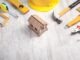 vecteezy_work-tools-with-a-wooden-house-model